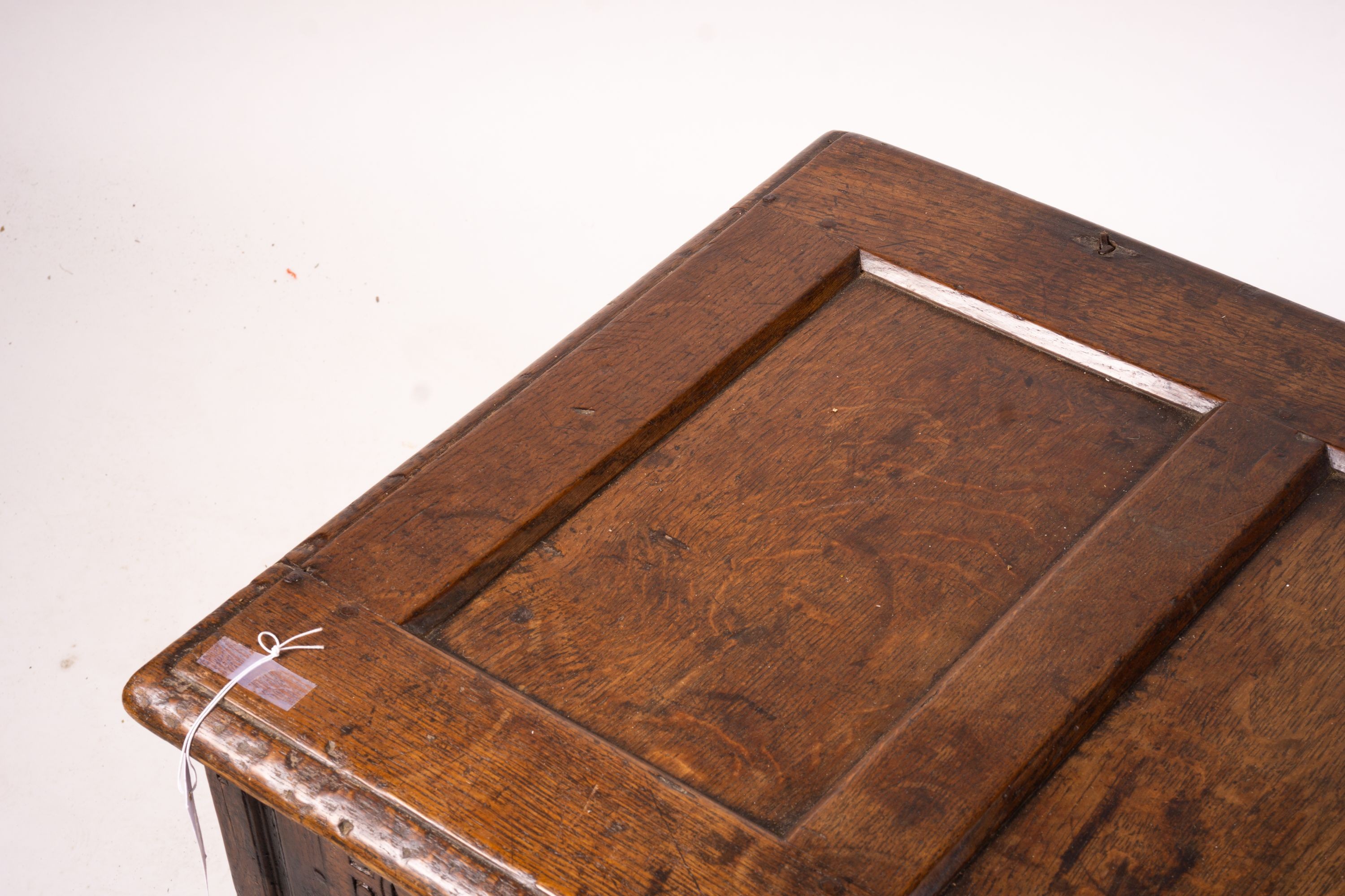 A 17th century panelled oak coffer, W.122cm D.55cm H.65cm